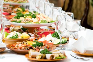 Catering table set service with silverware and glass stemware at restaurant before party
